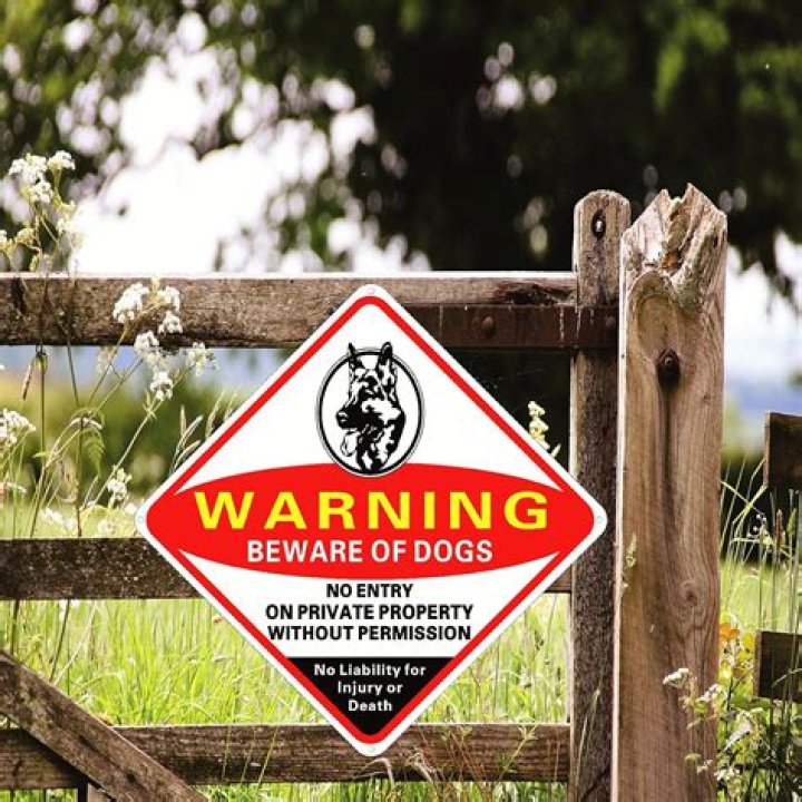 What does a Beware of Dog sign mean?
